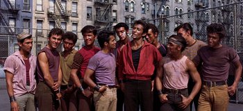 Movie still from “West Side Story” (1961), directed by Jerome Robbins – A group of young men standing next to each other; Medium shot, High angle