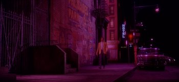 Movie still from “West Side Story” (1961), directed by Jerome Robbins – A man walking down the street at night; Extreme Wide shot, Low angle