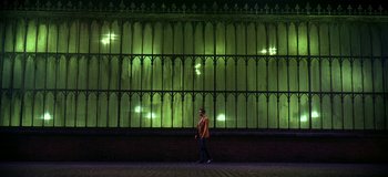 Movie still from “West Side Story” (1961), directed by Jerome Robbins – A man is walking in front of a building; Extreme Wide shot, Low angle