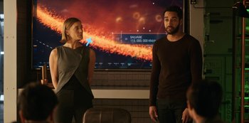 Movie still from “Another Life” (2019), created by Aaron Martin – A man and a woman standing next to each other; Medium shot, Over the shoulder angle