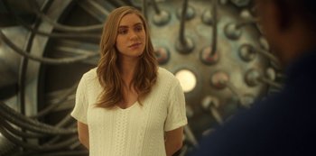 Movie still from “Another Life” (2019), created by Aaron Martin – A woman standing in front of a wall; Close Up shot, Over the shoulder angle