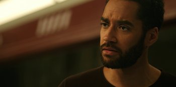 Movie still from “Another Life” (2019), created by Aaron Martin – A person with a beard; Close Up shot, Low angle