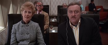 Movie still from “Westworld” (1973), directed by Michael Crichton – A group of people sitting in chairs in a room; Close Up shot, High angle