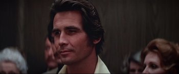 Movie still from “Westworld” (1973), directed by Michael Crichton – A person wearing a white shirt; Close Up shot, Over the shoulder angle