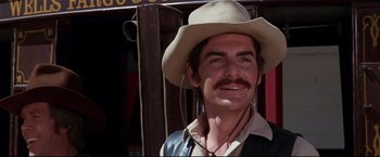 Movie still from “Westworld” (1973), directed by Michael Crichton – A man with a mustache wearing a cowboy hat; Close Up shot, Low angle