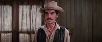 Movie still from “Westworld” (1973), directed by Michael Crichton – A man with a mustache wearing a cowboy hat; Close Up shot, Low angle