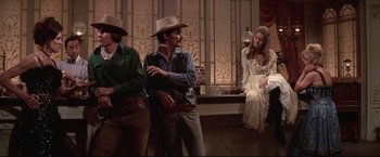 Movie still from “Westworld” (1973), directed by Michael Crichton – A group of men standing next to each other on a stage; Medium shot, Low angle