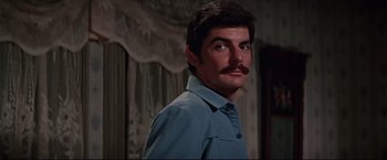 Movie still from “Westworld” (1973), directed by Michael Crichton – A person with a mustache; Close Up shot, Low angle