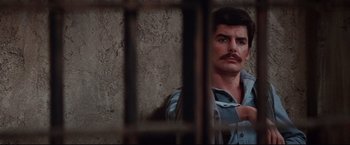 Movie still from “Westworld” (1973), directed by Michael Crichton – A man with a mustache sitting in a jail cell; Close Up shot, Low angle