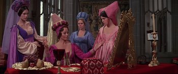 Movie still from “Westworld” (1973), directed by Michael Crichton – A group of women dressed in medieval costumes; Medium shot, Over the shoulder angle