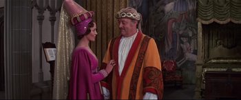 Movie still from “Westworld” (1973), directed by Michael Crichton – A man and a woman dressed up in costumes; Medium shot, Over the shoulder angle