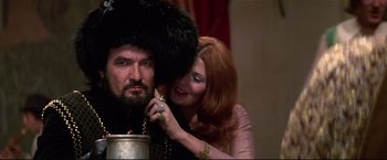 Movie still from “Westworld” (1973), directed by Michael Crichton – A man with a beard and a woman with red hair; Medium shot, Low angle
