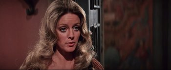 Movie still from “Westworld” (1973), directed by Michael Crichton – A person with long hair; Close Up shot, Over the shoulder angle