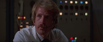 Movie still from “Westworld” (1973), directed by Michael Crichton – A person wearing a headset; Close Up shot, Low angle