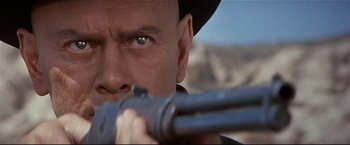 Movie still from “Westworld” (1973), directed by Michael Crichton – A person holding a gun; Close Up shot, Low angle