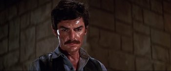 Movie still from “Westworld” (1973), directed by Michael Crichton – A person with a mustache; Close Up shot, Low angle