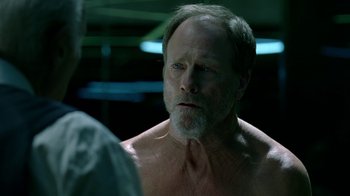 Movie still from “Westworld” (2016), created by Lisa Joy – An older man is looking at a younger man; Close Up shot, Over the shoulder angle