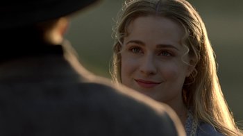 Movie still from “Westworld” (2016), created by Lisa Joy – A woman's face as she looks at a man; Close Up shot, Over the shoulder angle