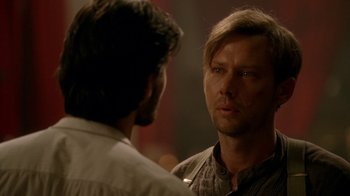 Movie still from “Westworld” (2016), created by Lisa Joy – A man with long blonde hair is looking at another man with long hair; Close Up shot, Over the shoulder angle