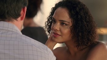 Movie still from “Westworld” (2016), created by Lisa Joy – A beautiful young lady sitting in front of a man; Close Up shot, Over the shoulder angle