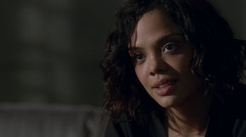 Movie still from “Westworld” (2016), created by Lisa Joy – A person with curly black hair; Close Up shot, Over the shoulder angle