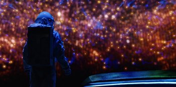 Movie still from “Another Life” (2019), created by Aaron Martin – A person in a spacesuit standing in front of a wall; Wide shot, Over the shoulder angle
