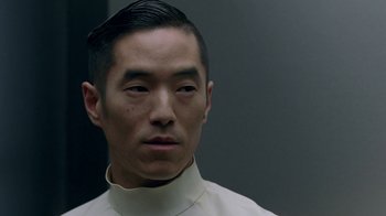 Movie still from “Westworld” (2016), created by Lisa Joy – A person wearing a white shirt; Close Up shot, Low angle