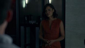 Movie still from “Westworld” (2016), created by Lisa Joy – A woman in an orange dress standing in front of a mirror; Medium shot, Over the shoulder angle