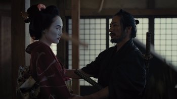 Movie still from “Westworld” (2016), created by Lisa Joy – A woman dressed as a geisha and a man dressed as a samurai; Medium shot, Over the shoulder angle
