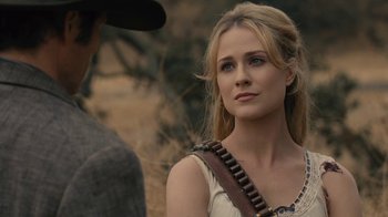 Movie still from “Westworld” (2016), created by Lisa Joy – A woman in a cowboy hat is looking at a man in a cowboy hat; Close Up shot, Over the shoulder angle