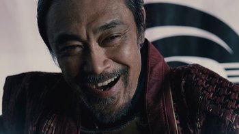 Movie still from “Westworld” (2016), created by Lisa Joy – A person smiling with his mouth open; Close Up shot, Over the shoulder angle