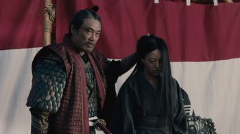 Movie still from “Westworld” (2016), created by Lisa Joy – A man and a woman dressed in samurai garb; Medium shot, Low angle