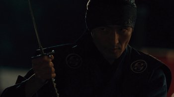 Movie still from “Westworld” (2016), created by Lisa Joy – A man holding a sword in the dark; Close Up shot, Low angle