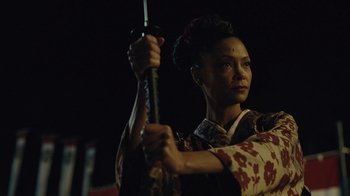 Movie still from “Westworld” (2016), created by Lisa Joy – A person holding a sword in a dark room at night; Close Up shot, Low angle