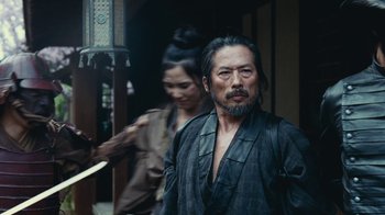 Movie still from “Westworld” (2016), created by Lisa Joy – A man and a woman are standing in a doorway; Medium shot, Over the shoulder angle