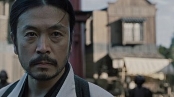 Movie still from “Westworld” (2016), created by Lisa Joy – A person wearing a robe; Close Up shot, Low angle