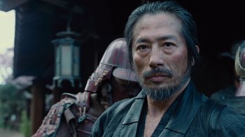 Movie still from “Westworld” (2016), created by Lisa Joy – A man with a beard standing in front of another man; Close Up shot, Over the shoulder angle