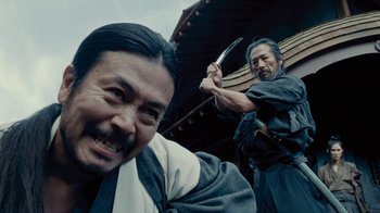 Movie still from “Westworld” (2016), created by Lisa Joy – Two men in traditional japanese garb with a sword in their hands; Close Up shot, Low angle