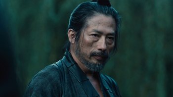 Movie still from “Westworld” (2016), created by Lisa Joy – A person with a beard; Close Up shot, Low angle