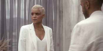 Movie still from “Another Life” (2019), created by Aaron Martin – A woman in a white jacket looking at a mirror; Medium shot, Over the shoulder angle