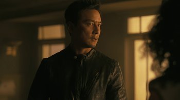 Movie still from “Westworld” (2016), created by Lisa Joy – A man in a leather jacket looking to his left; Close Up shot, Low angle