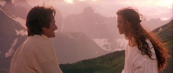 Movie still from “What Dreams May Come” (1998), directed by Vincent Ward – A man and a woman talking to each other; Medium shot, Low angle
