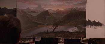 Movie still from “What Dreams May Come” (1998), directed by Vincent Ward – A painting of a lake and a mountain range; Extreme Wide shot, High angle