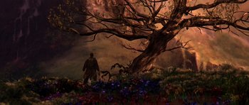 Movie still from “What Dreams May Come” (1998), directed by Vincent Ward – A man standing in front of a tree with flowers; Extreme Wide shot, Low angle