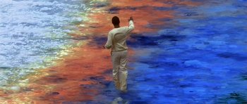 Movie still from “What Dreams May Come” (1998), directed by Vincent Ward – A painting of a man walking on a colorful floor; Wide shot, High angle