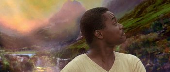 Movie still from “What Dreams May Come” (1998), directed by Vincent Ward – A man with his mouth wide open looking up at the sky; Close Up shot, Low angle