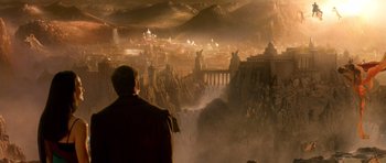 Movie still from “What Dreams May Come” (1998), directed by Vincent Ward – A man standing in front of a painting of an ancient city; Extreme Wide shot, High angle
