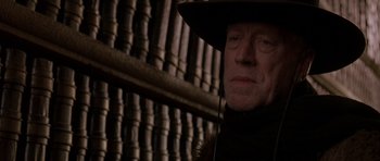 Movie still from “What Dreams May Come” (1998), directed by Vincent Ward – A person wearing a hat; Close Up shot, Over the shoulder angle