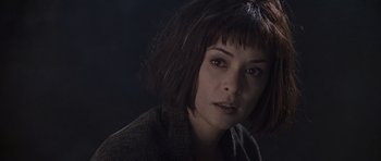 Movie still from “What Dreams May Come” (1998), directed by Vincent Ward – A person wearing a jacket; Close Up shot, High angle