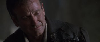 Movie still from “What Dreams May Come” (1998), directed by Vincent Ward – A person with his eyes closed; Close Up shot, Over the shoulder angle